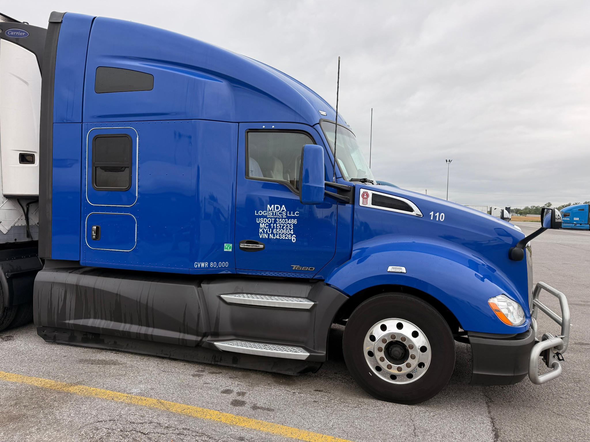 Temperature-controlled refrigerated trucking trailer by MDA Logistics for transporting perishable cargo safely.